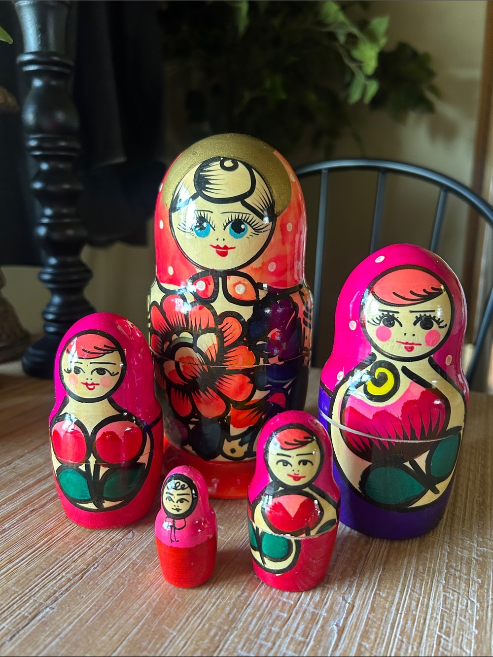 Vintage hand-painted wooden Russian nesting dolls.